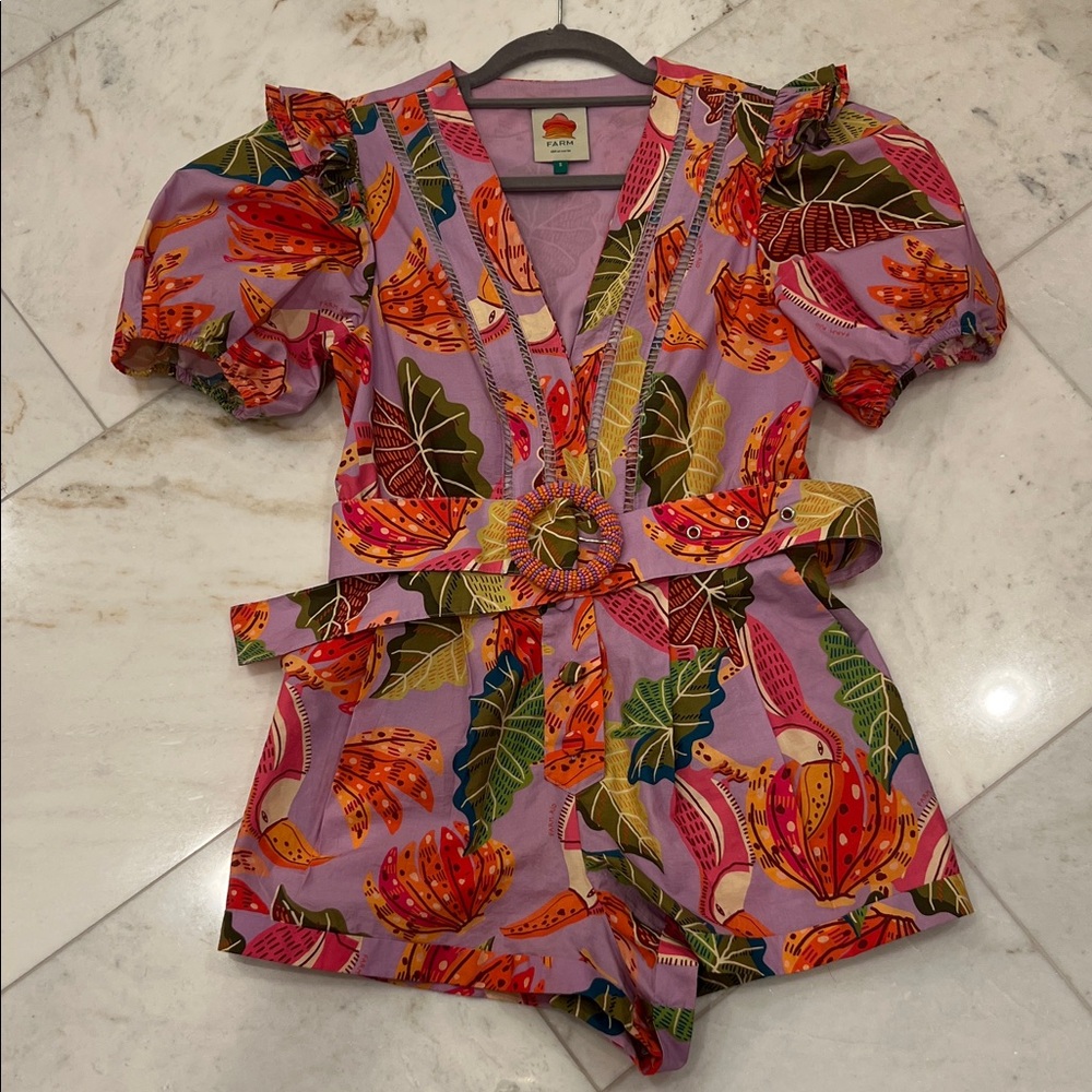 Farm Rio romper size small. Fun print, buttons down front with belt.